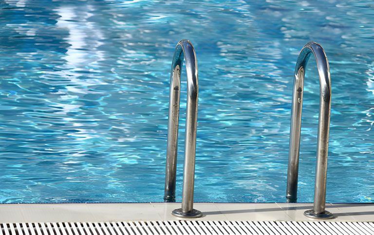 Pool ladder in crystal clear water