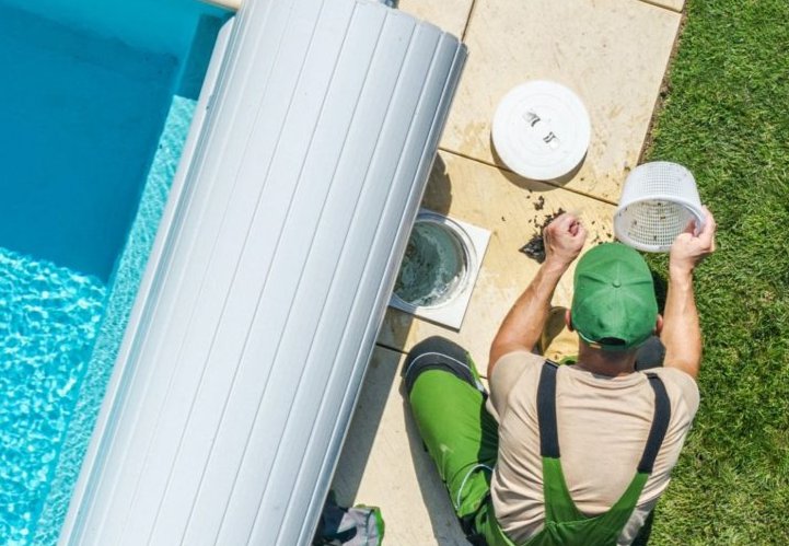 Pool rehabilitation technician inspecting equipment